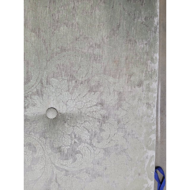 Elegant and practical silver gray velvet ottoman. This piece was custom upholstered in a soft gray and silver fabric. The...