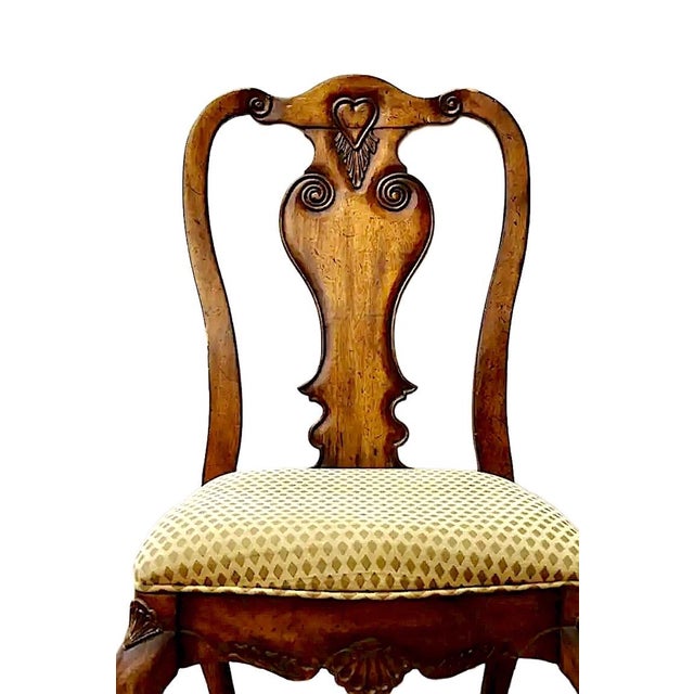 Hand-carved, paw foot side chair with shell and heart decoration.