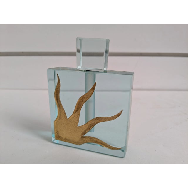 Exquisite signed Jeffery M. Andrews cold cut glass perfume bottle from Felt Glass. Renowned for its artistry and unique...