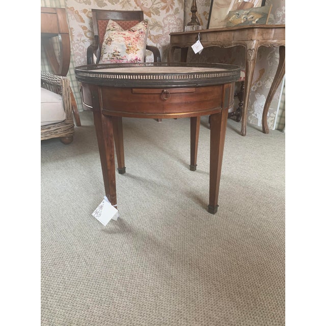 French round stone tor bouillotte table. Made in the 18th century.