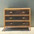 This vintage three-drawer dresser beautifully reflects mid-20th-century design through its refined balance of texture,...