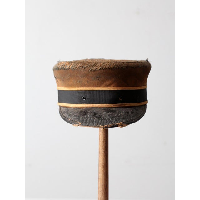 The aged charm of this 20th-century conductor's hat, made by AG Meier & Co. of Chicago, makes it a distinctive decorative...