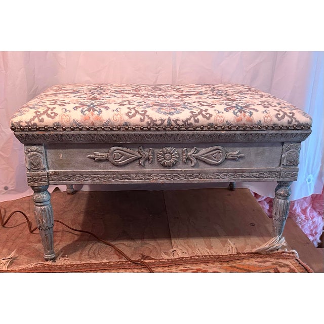 Elegant carved painted storage bench sourced from John Rosselli Antiques, New York, reflecting a refined neoclassical /...