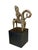 This vintage Dogon bronze equestrian figure on a black wooden stand is a mrammuo—a traditional gold weight—measuring 5.25"...