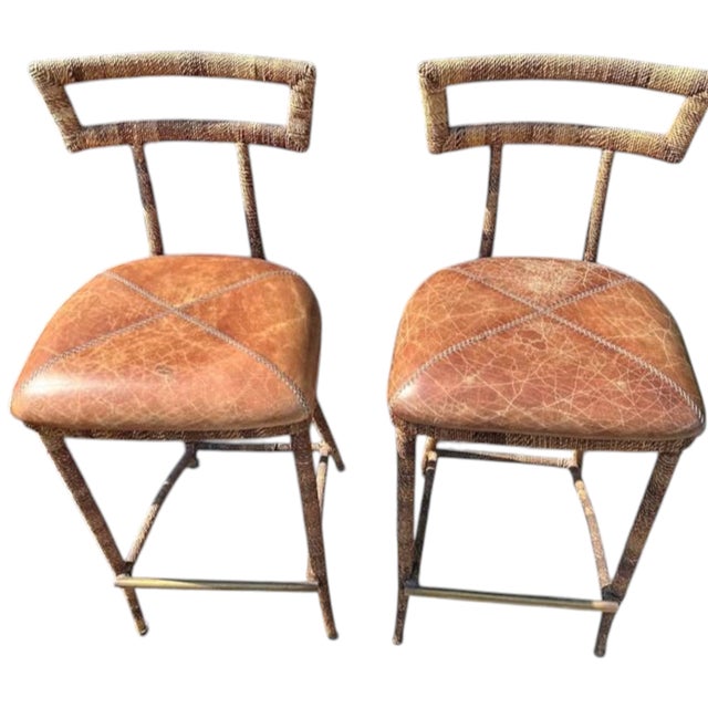 Pair of Vintage Maitland-Smith Campaign Bar Stools Elevate your home bar or kitchen island with this stunning pair of...