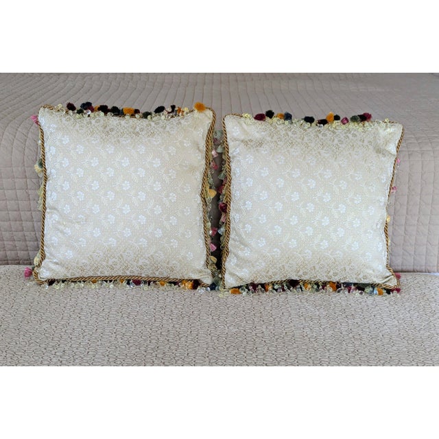 Size: 13" x 5" x 13" Pattern: Scroll applique and floral Fabric: Silk Colors: Cream, gold, jewel tone tassels Zipper:...