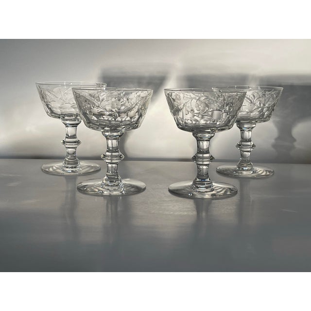 A set of four elaborately patterned champagne glasses in excellent condition. Ships within 1-2 days using USPS. All items...