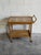 Beautiful vintage Danish serving cart in style of Henning Kjærnulf, crafted in solid oak with a decorative ceramic tile...
