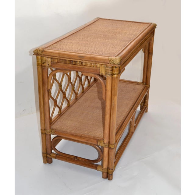 Mid-Century Modern Boho Chic rectangular bamboo Console with a handwoven Cane Top and bend Bamboo corners. Useful as Dry...
