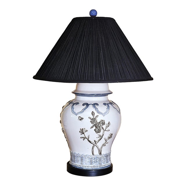 Late 20th Century Chinese Chinoiserie Porcelain Table Lamp With Relief Floral Motif & Black Shade, 30"h For Sale