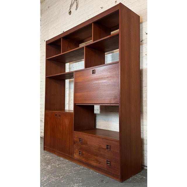 Freestanding Danish wall unit, circa 1970s. Its clean geometric profile and minimalist lines are emblematic of classic...