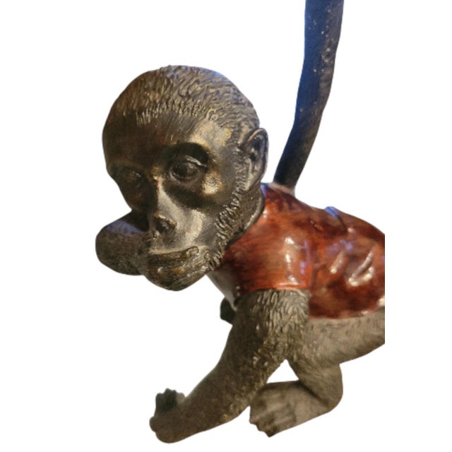 A sweet fun playing monkey taper candle holder. This is such an unusual candle holder with a tortoiseshell like finish...