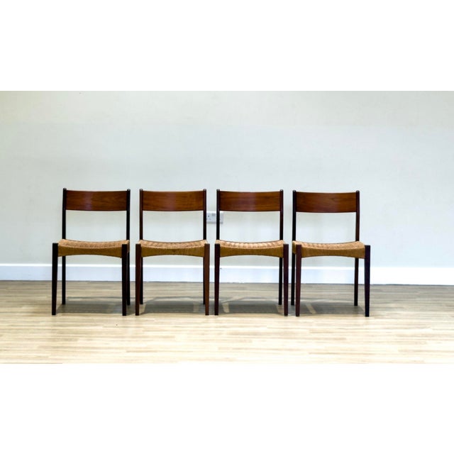 Set of Danish Mid-Century Dining Chairs in Afromosia with Papercord by Poul Volther Seats, 1960s This elegant set of...