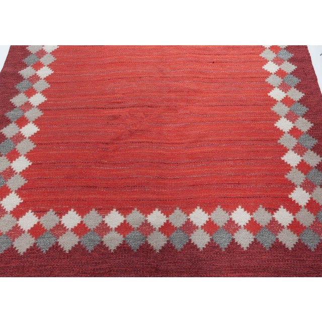 Midcentury Swedish red flat woven rug by Ingegerd Silow Size: 6'3" × 9'10" (190 × 299 cm) A masterful example of mid-...