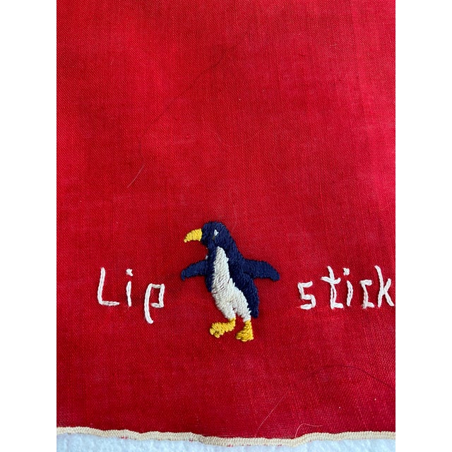 Vintage linen lipstick towel with embroidered penguin. Lipstick towels were a fad in the 1940s and purportedly created to...
