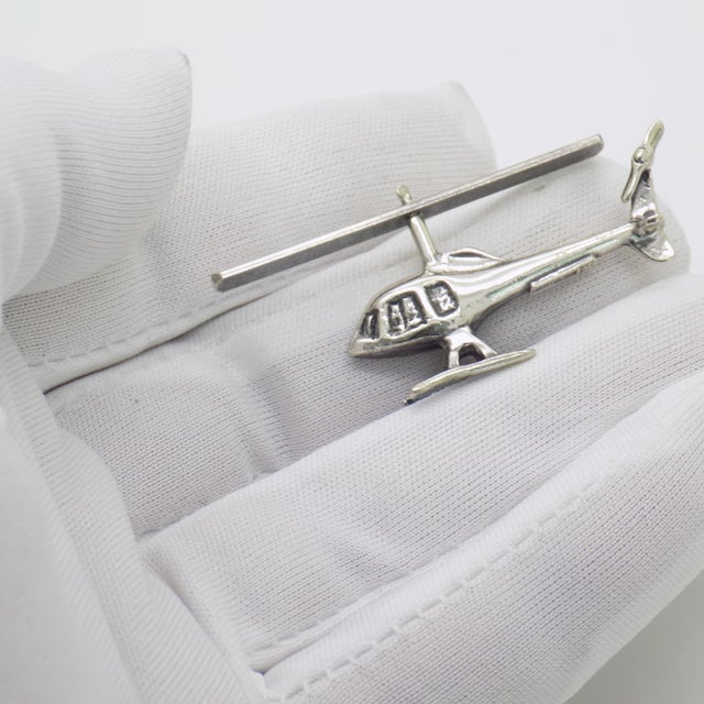 A dynamic vintage miniature depicting a helicopter, handmade in Continental Silver (800/000) in Arezzo between the 1980s...