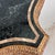 This is a STUNNING Maitland Smith wall-mounted table with a tesselated stone top. The base is carved and resets on a...