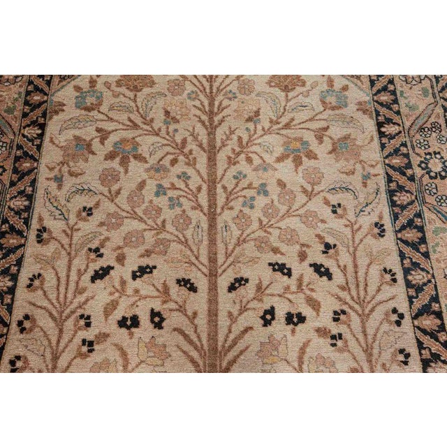 This 1930's Antique Persian Tabriz rug is a beautiful example of the artistry and refinement that made Tabriz one of...
