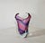 Murano production circa 1970. Thick vase in colorless, lilac, and blue sommerso glass, decorated with a ribbon-like...