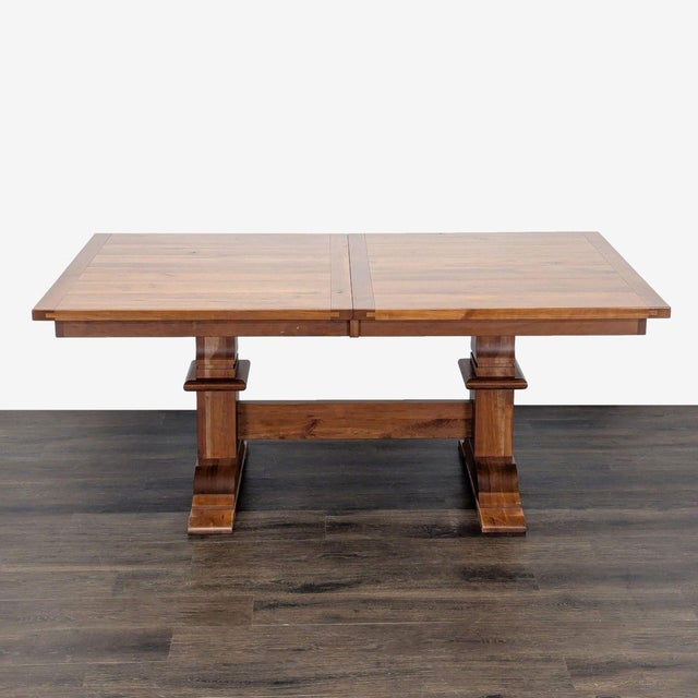 Trestle table with 2 leaf inserts expanding to 104.25 inches. Leaves self-store within the table Brand Amish Tables...