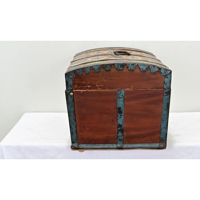 Dimensions: 10 ¾” H x 19” W x 12 ⅜” D A petite painted marriage trunk from 19th century Sweden, in tabletop scale. This...