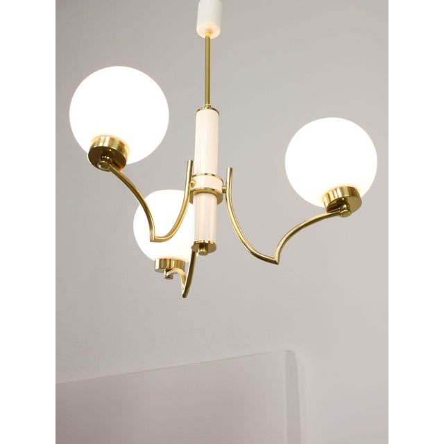 Real brass. Takes 3x e27 light bulb (not included). A standard e26 american/canadian size also fits (tested). Works with...