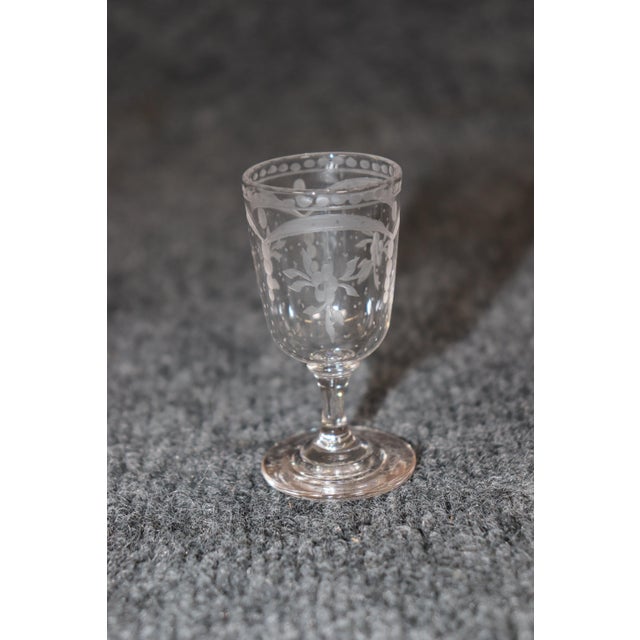This is a superb tantalus with its original etched glass cordial glasses and etched glass decanters for whiskey or...