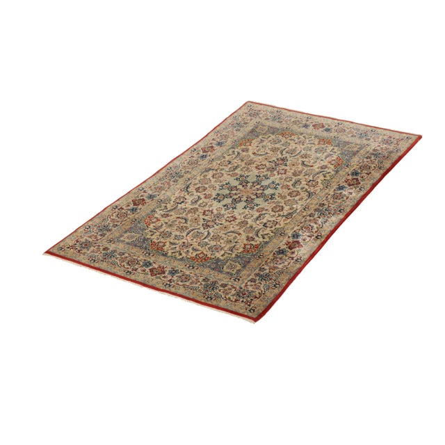 Hand knotted in a luxurious wool and sheen silk originating circa 1950-1960, this vintage Persian rug connotes a mid-...