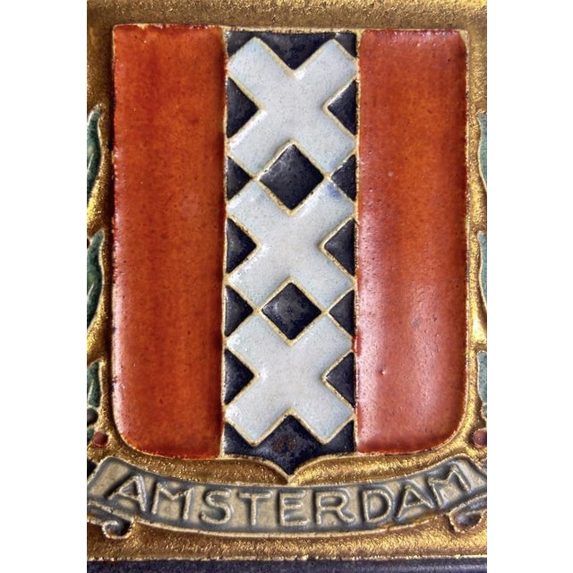 A Royal Delft / De Porceleyne Fles cloisonné tile depicting the coat of arms of Amsterdam, with the city’s three white...