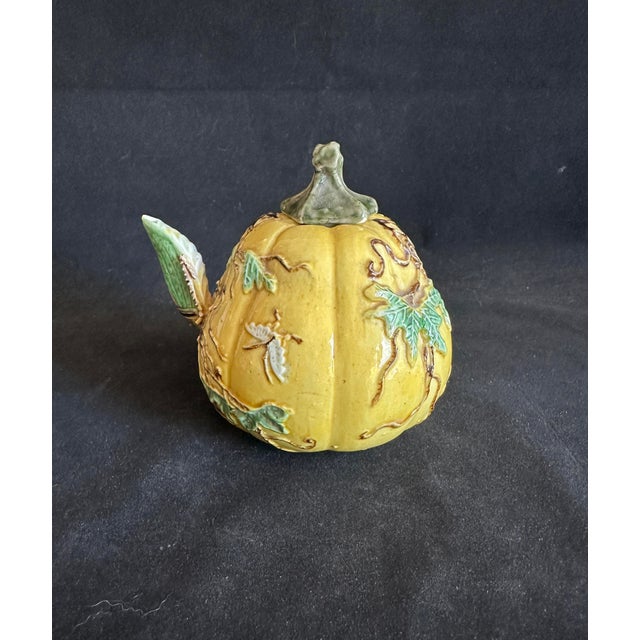 This antique Chinese porcelain ceramic water dropper is shaped in the form of a gourd. Its colorful and intricate surface...