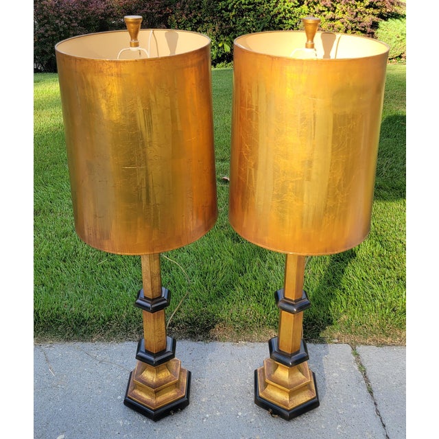 This striking pair of oversized metallic copper table lamps from Rembrandt Lamp Company channels the bold colors and...