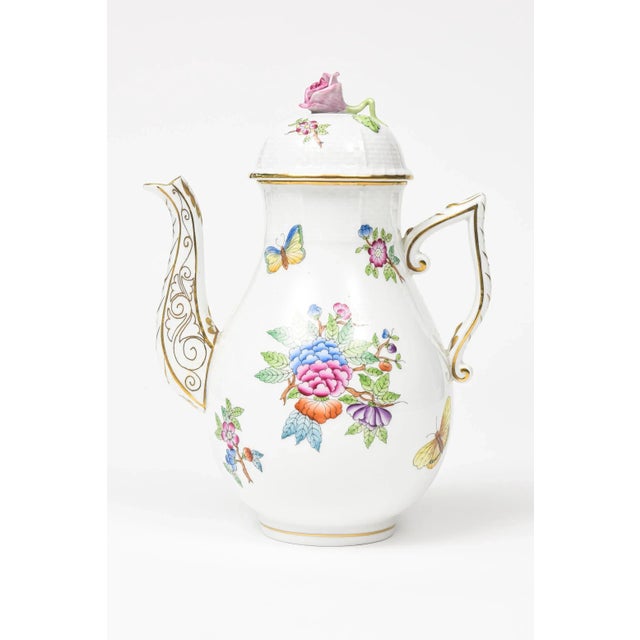 Elegant Herend China coffee pot with flower lid . This is the older pattern of Queen Victoria that does not have the green...