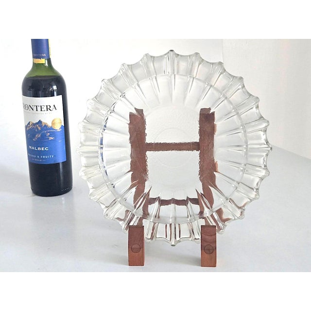 Offered is a 1960s large starburst heavy pressed glass ashtray catchall by Fostoria Glass Company. Pretty enough to use as...