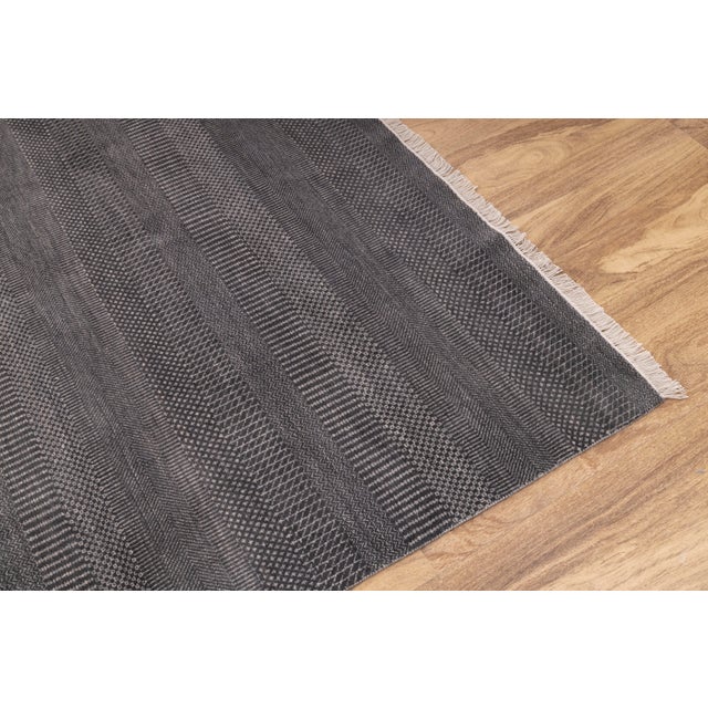 Featuring a super soft wool surface, the rug is easy to wash and maintain. Every inch of this rug is made by hand.