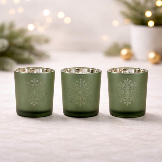 Bring warmth, sophistication, and artistry into your home with this set of frosted glass candle holders. Add a touch of...