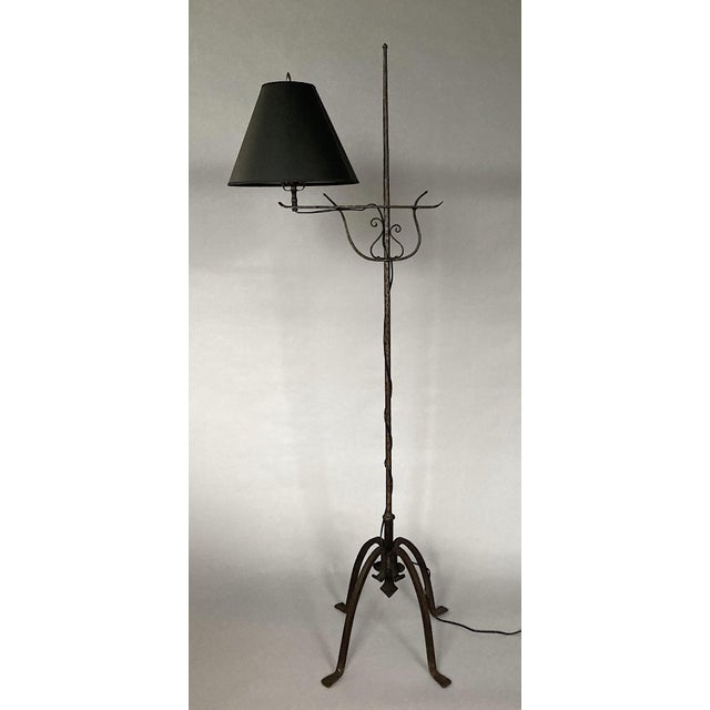 Offering an exceptionally well-crafted hand-made wrought iron floor lamp of striking visual interest. The element holding...