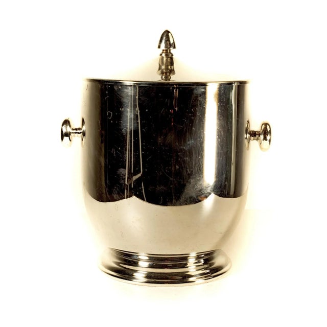 An elegant and classic insulated ice bucket with lid by Maestri. Stamped in the bottom with makers name and the name of...