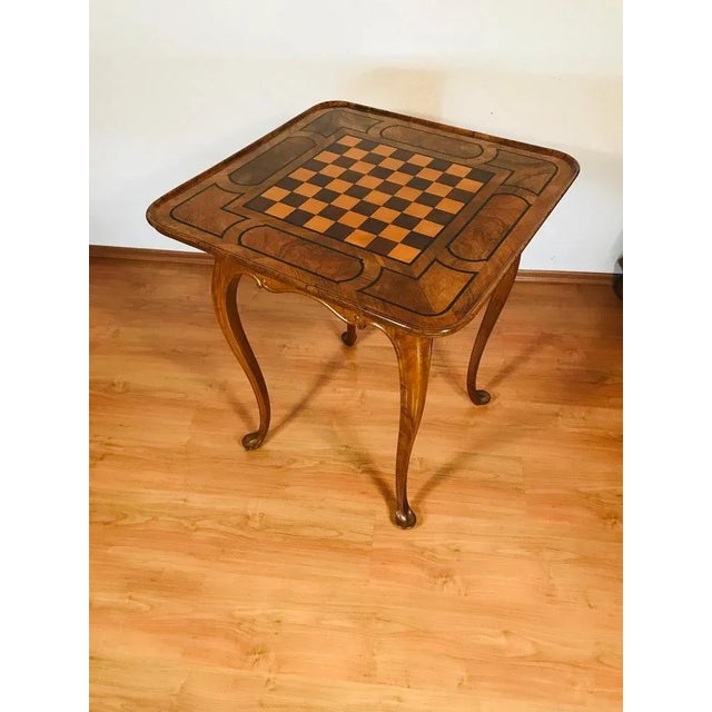 This rare Baroque chess table from Germany, dating to around 1750, combines decorative artistry with timeless...