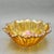 Bring a radiant burst of retro charm to your home with this striking marigold carnival glass bowl, featuring a highly...