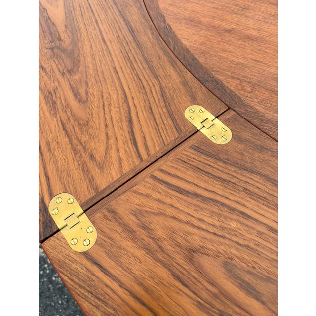 A truly unique design and well-executed concept. Teak and rosewood combo with brass hinges. The flip flap design on the...