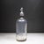 ABOUT Antique heavy glass mineral water seltzer siphon bottle with chrome plated dispensing head. Acid-etched lettering on...