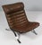 Low slung steel framed leather 'Ari' Lounge chair by Swedish designer Arne Norell from 1966. This vintage lounge chair...