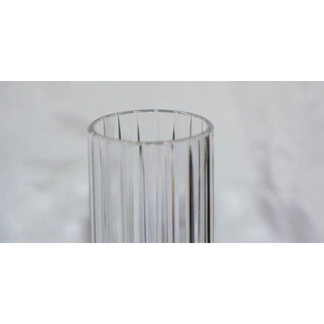 Elegant clear cut crystal forms this daffodil vase by Baccarat of Italy. The vertical ribs are perfectly cut to add to its...
