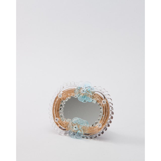 Murano mirror embellished with a decorative gold flecked glass border and blue flowers, can be used on a stand or attached...