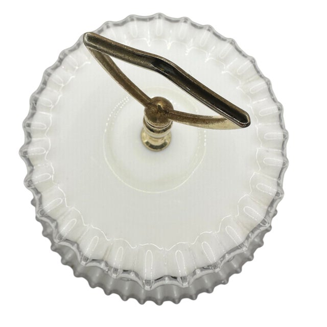 The Fenton Silver Crest Three Tiered Tidbit Tray is a masterpiece of elegance and functionality. This timeless piece...