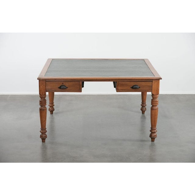 Antique writing desk/partner desk with 4 drawers and a green leather top has a beautiful appearance. This antique writing...