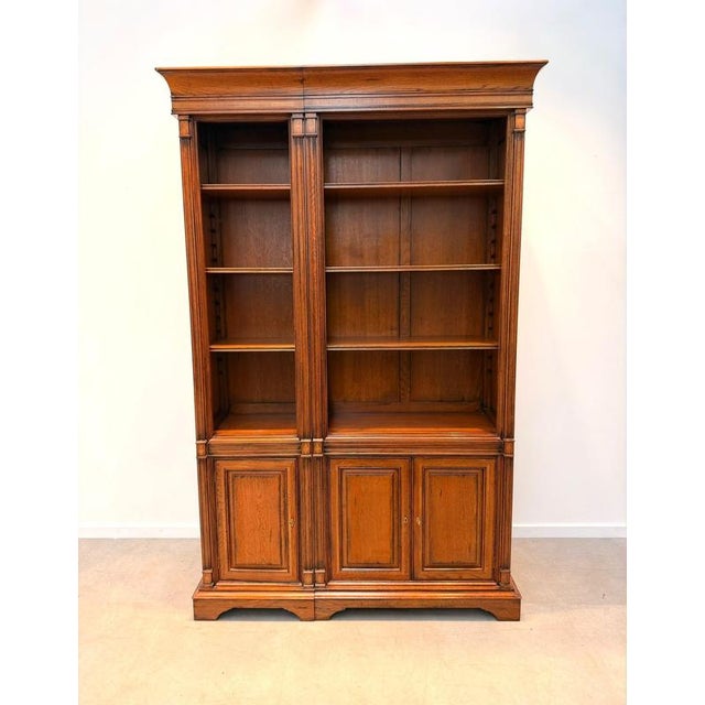 Elegant open bookcase cabinet from the "Antique Collection" series, crafted in warm cherrywood with a rich traditional...