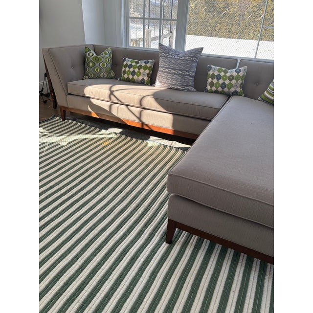 Danner right facing sectional upholstered in Stockholm Clay loose weave (greige) performance linen with walnut tapered...