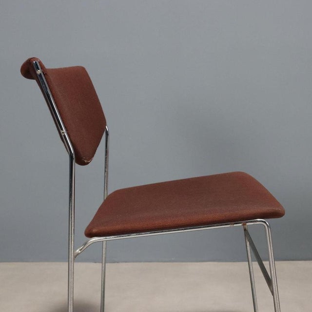 Pair of chairs, chromed metal, foam padding, fabric upholstery. This piece is attributed to the mentioned designer/maker....