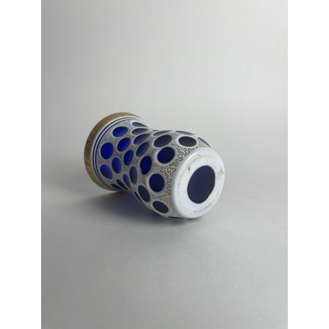 This blue glass beaker, dating to mid-19th century Bohemia, is a stunning example of the refined glassmaking traditions of...